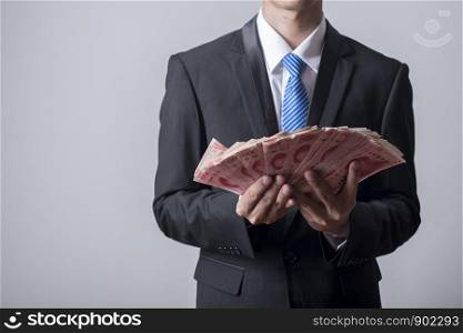 Business man holding China money