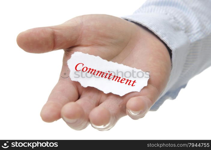 Business man holding commitment note on hand