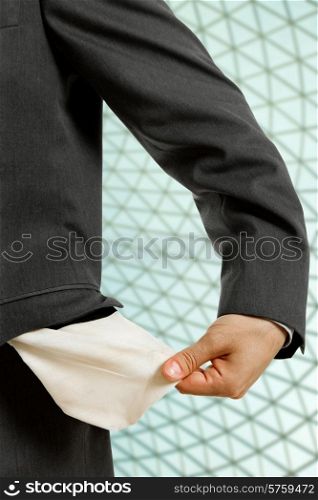 business man holding his empty pocket, detail