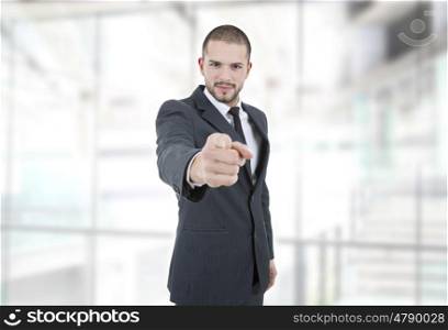 business man in a suit pointing with his finger at the office
