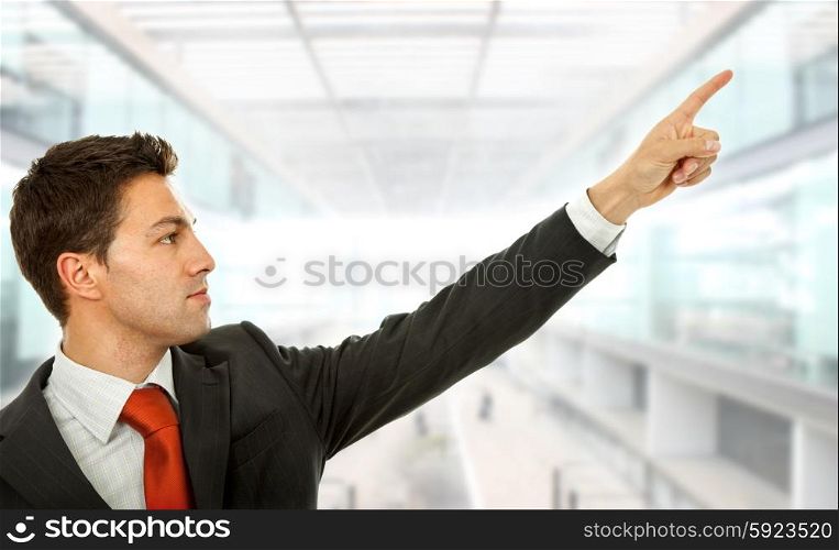 business man in a suit pointing with his finger, at the office