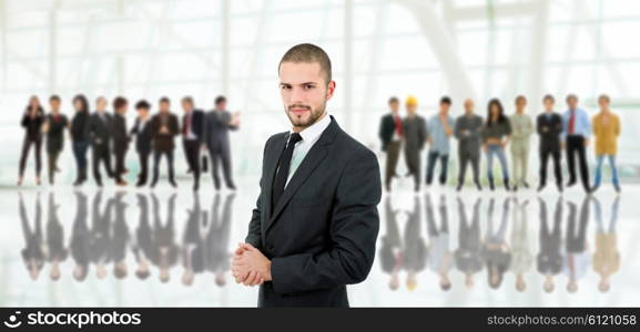 business man in front of a group of people at the office