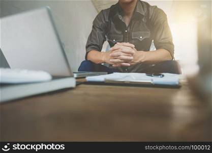 Business man in relax casual form working with laptop sitting on sofa at office