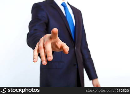 Business man in suit pushing a button with his finger