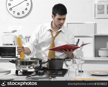 business man in the kitchen preparing dinner