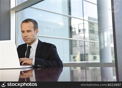 Business man is working with laptop