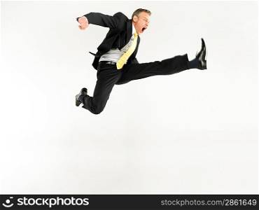 Business man jumping full length