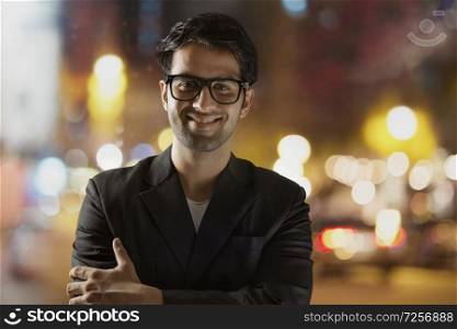 Business man looking at camera on street wearing eyeglasses 