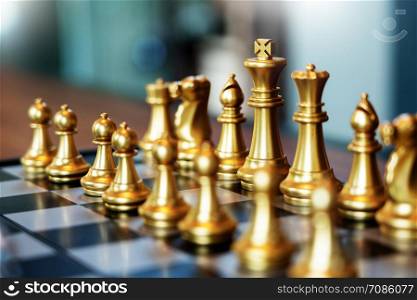 Business man moving chess game for business competition and team work concept.