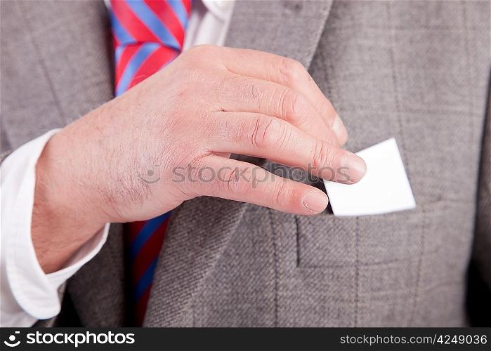 Business man offering card - focus on the hand