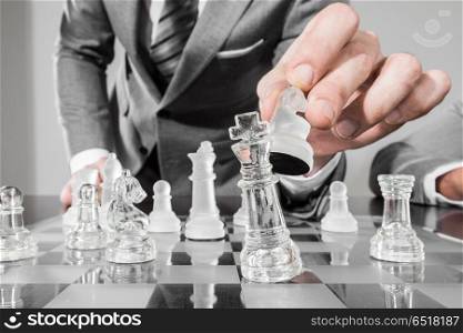Business man playing chess. Business man playing chess, business strategy concept
