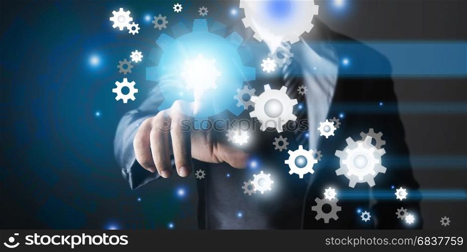 Business man pointing out to mechanical gear icons