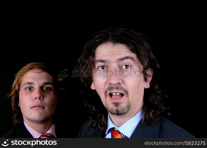 business man portrait isolated on black background, focus on the right man