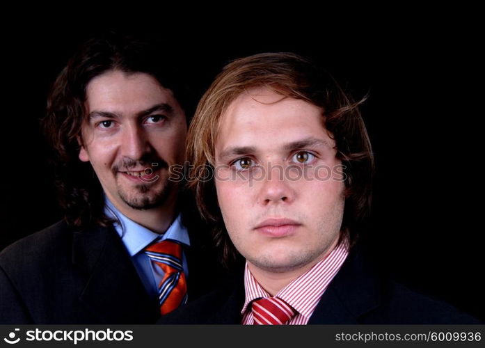 business man portrait isolated on black background, focus on the right man