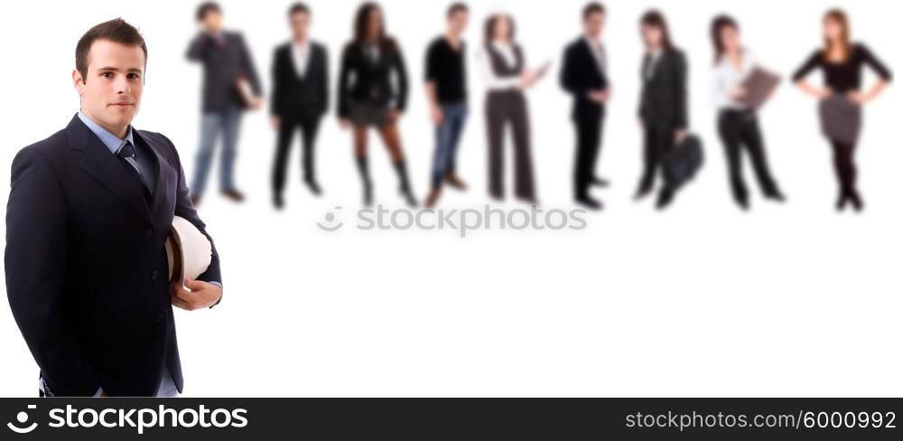 Business man posing with people in background