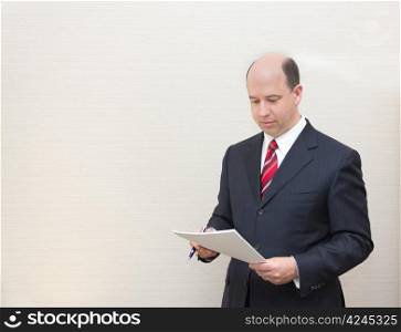 Business man reading a document.