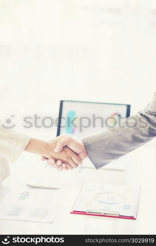 business man shaking hands during a meeting in the office, success, dealing, greeting and partner concept.