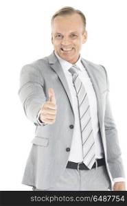 Business man showing thumb up. Mature business man showing thumb up gesture, isolated on white background