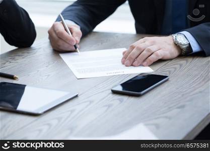 Business man sign contract on the desk at meeting. Business man sign contract