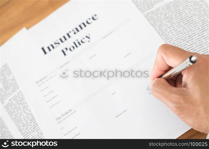 business man signing an insurance policy