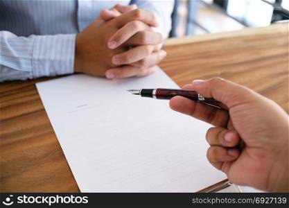 Business man signing contract making a deal with partnership agreement concept