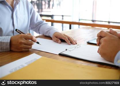 Business man signing contract making a deal with partnership agreement concept