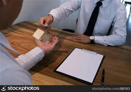 business man signing contract making a deal with real estate agent Concept for consultant
