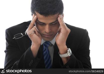 Business man suffering from severe headache