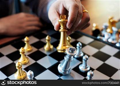 Business man take a king figure checkmate on the chess board game - strategy, management or leadership success concept