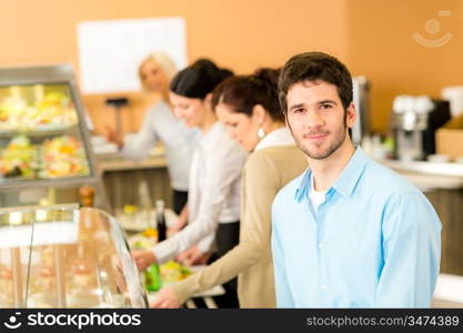 Business man take cafeteria lunch food from display cabinet self-service