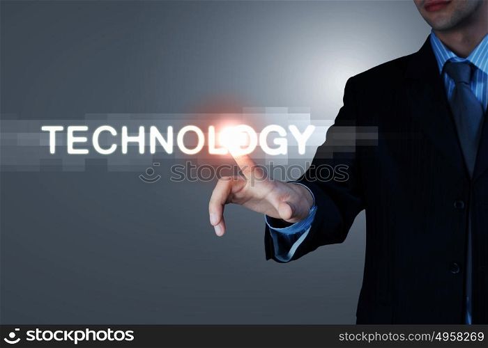 Business man touching display. Business man touching virtual display. Business and technology concept