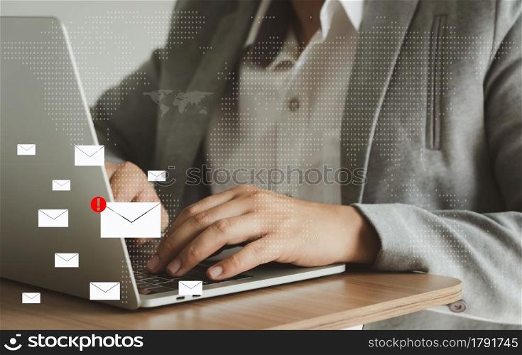 Business man using laptop about problem digital online marketing on office desk. Business - finance technology concept. icon online e-commerce. Spam email web from internet and hacker solution.