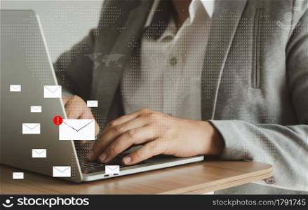Business man using laptop about problem digital online marketing on office desk. Business - finance technology concept. icon online e-commerce. Spam email web from internet and hacker solution.