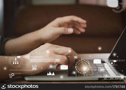 Business man using laptop for digital online marketing on office desk. Business - finance technology concept.icon online e-commerce global market shopping,banking and payments.planning and strategy.