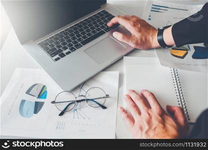 Business man Using Laptop in office