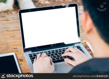 business man using laptop on wood table in coffee shop.