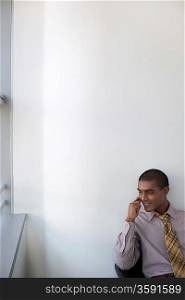 Business man using mobile phone in office elevated view