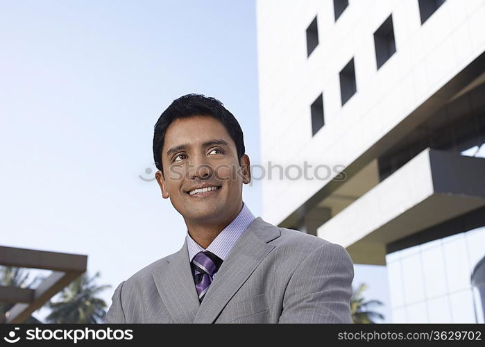 Business man using mobile phone outdoors