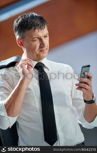 business man using phone at modern office space