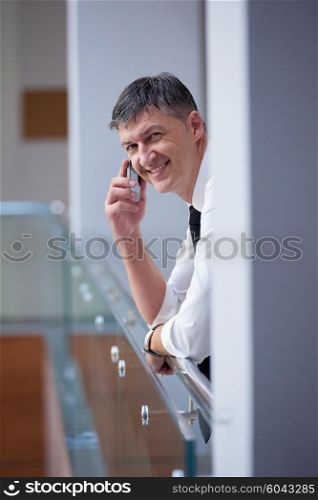 business man using phone at modern office space