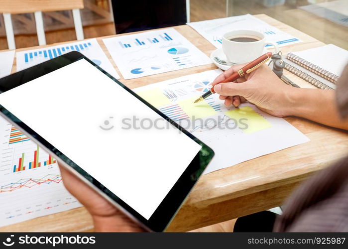 Business man Using tablet blank screen with Report chart