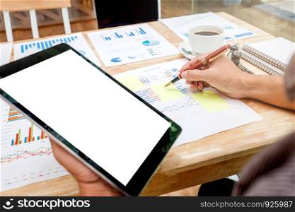 Business man Using tablet blank screen with Report chart