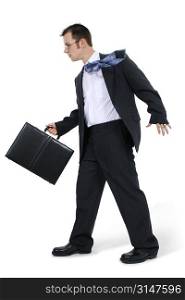 Business Man Walking With Briefcase. Tie blowing in wind.