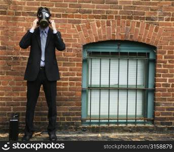 Business man with a gas mask