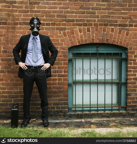 Business man with a gas mask