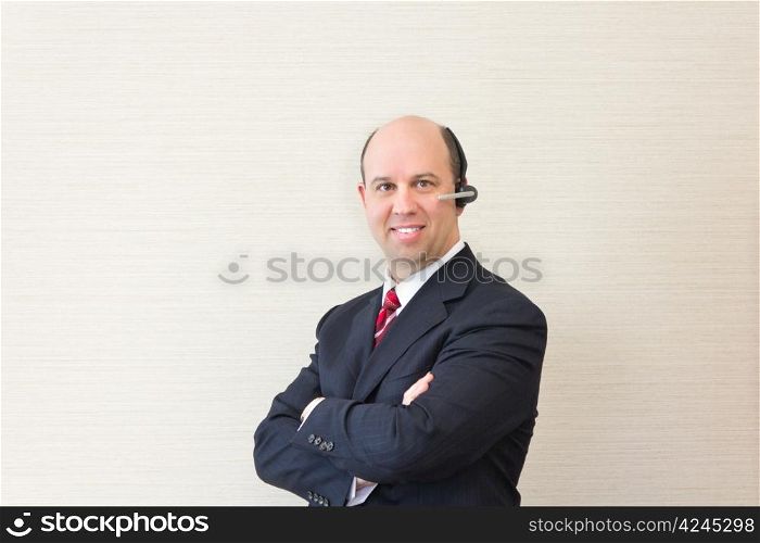 Business man with a handsfree telephone headset.