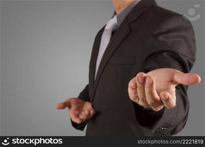  business man with an open hand as showing something concept