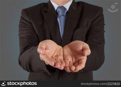  business man with an open hand as showing something concept