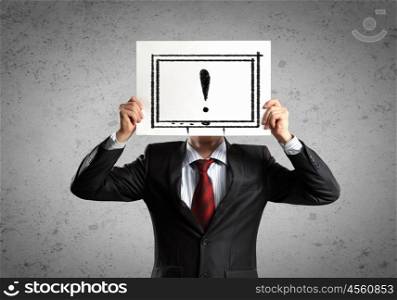 Business man with board. Image of businessman holding message board against face. Conceptual photo