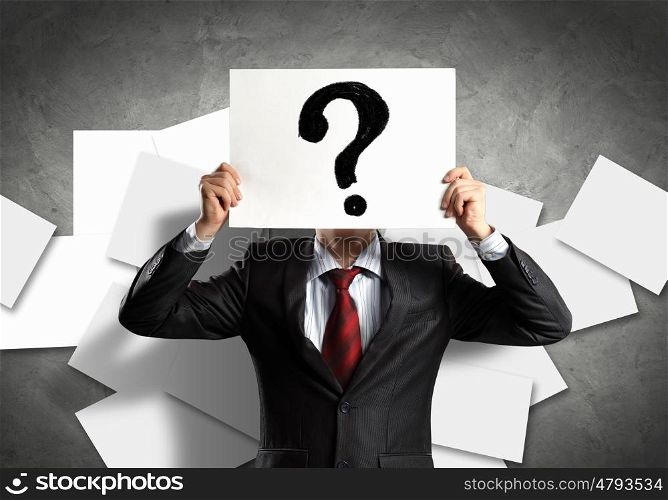 Business man with board. Image of businessman holding message board against face. Conceptual photo
